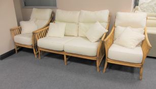 A bamboo and wicker three piece conservatory suite