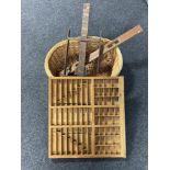 A wicker log basket, vintage spirit level,
