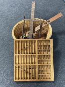 A wicker log basket, vintage spirit level,