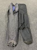Two heavy duty fishing rod bags containing rod cases and fishing parasols