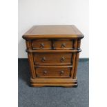 A contemporary hardwood four drawer chest