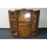 A 1930's side by side bureau display cabinet