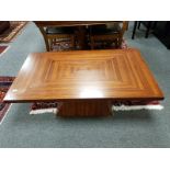 An Art Deco style coffee table 122 cm length