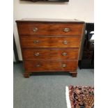 A George III mahogany four drawer chest on bracket feet,