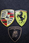 Three cast iron plaques - Porsche, Ferrari,
