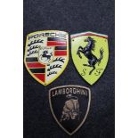 Three cast iron plaques - Porsche, Ferrari,