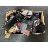 A box of assorted lady's hand bags and clothing
