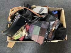 A box of assorted lady's hand bags and clothing