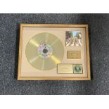 A framed The Beatles Abbey Road limited edition gold record,