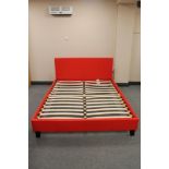 A contemporary red leather 5' bed frame (unassembled,