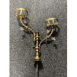 An antique brass two branch candle holder CONDITION REPORT: Height 60cm. width 45cm.