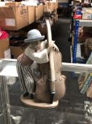 A Lladro figure, Jazz Bass 5834, boxed. CONDITION REPORT: In good condition.