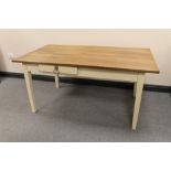 An oak topped pine based kitchen table fitted two drawers