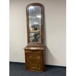A continental mahogany and walnut cabinet plus an arch topped hall mirror