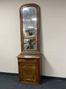 A continental mahogany and walnut cabinet plus an arch topped hall mirror