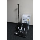 A boxed 30 litre chrome bin, boxed three candle pendant light fitting,