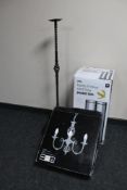 A boxed 30 litre chrome bin, boxed three candle pendant light fitting,