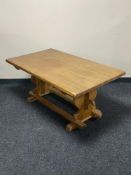 A blonde oak refectory coffee table