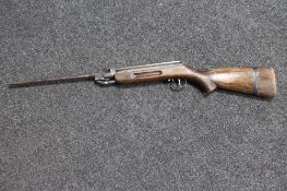 A mid 20th century spring loaded air rifle