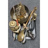 A tray of assorted brass ware, horse brasses on strap, vintage mincer,