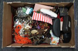 A box of costume jewellery and sunglasses