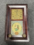 An antique stained beech wall clock with weights