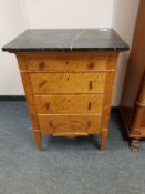 A continental satinwood four drawer chest with marble top, width 62 cm.