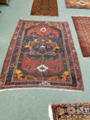 An antique Kurdish rug 146 cm x 210 cm