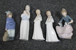 Five Nao figures in nightdress,