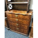 An antique mahogany and pine four drawer chest with brass drop handles