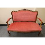 A French carved walnut framed salon settee in pink dralon