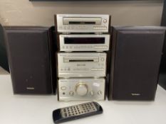 A four piece Technics micro hi/fi with speakers and remote