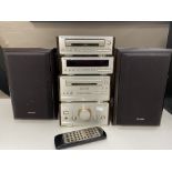 A four piece Technics micro hi/fi with speakers and remote