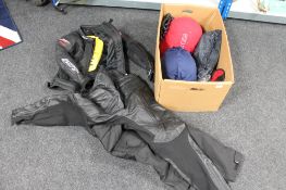 A box of motorcycle leathers,