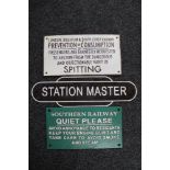 A cast iron station master plaque and two further cast iron railway notices