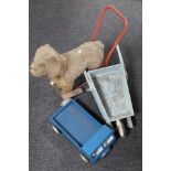 A mid 20th century push along soft toy dog on trolley,
