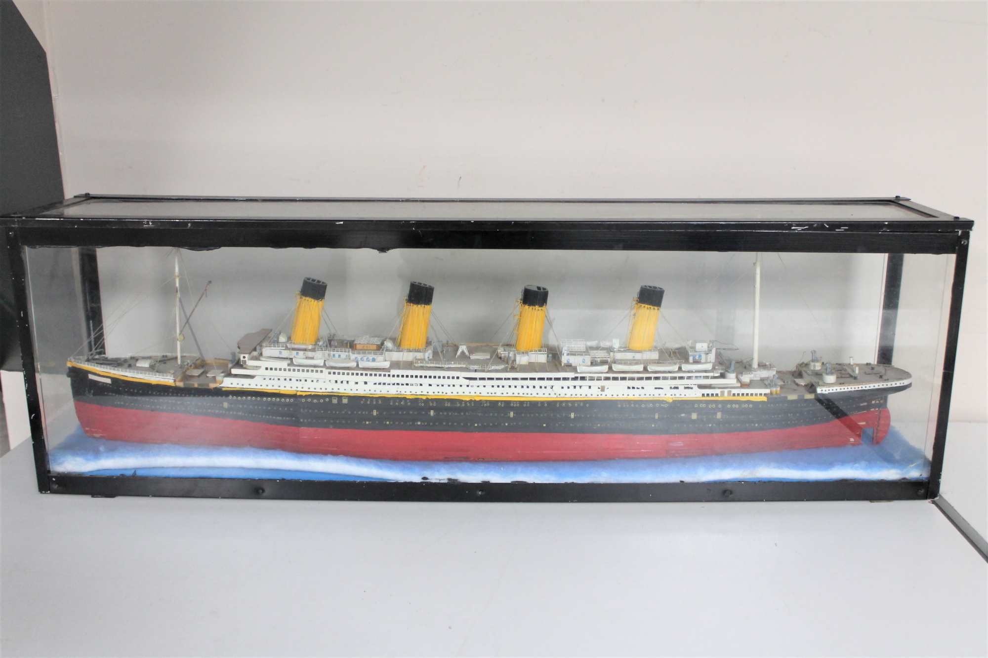 A hand built model of the Titanic in display case