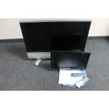 A Sharp 32 inch LCD TV with instructions and remote,