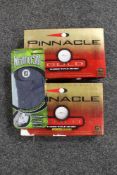 Two boxes of Pinnacle golf balls and a golf glove