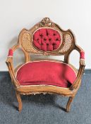 A French walnut bedroom armchair in red dralon