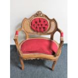 A French walnut bedroom armchair in red dralon