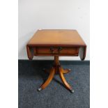 An inlaid yew wood flap sided occasional table