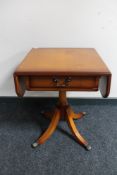 An inlaid yew wood flap sided occasional table