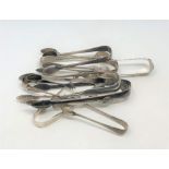 Eleven pairs of silver sugar tongs,