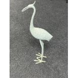 A cast metal figure of a heron