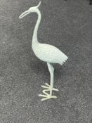 A cast metal figure of a heron