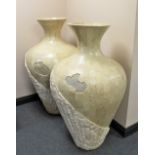 A pair of large floor standing vases