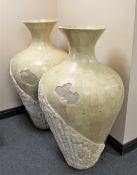A pair of large floor standing vases