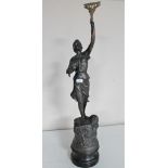 An antique spelter figure of a female with arm raised