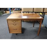 A mid 20th century Danish single pedestal desk CONDITION REPORT: Faded throughout